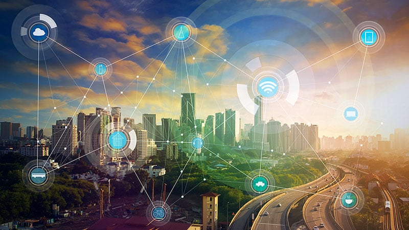 Futuristic cityscape depicting the interconnectivity of many devices.